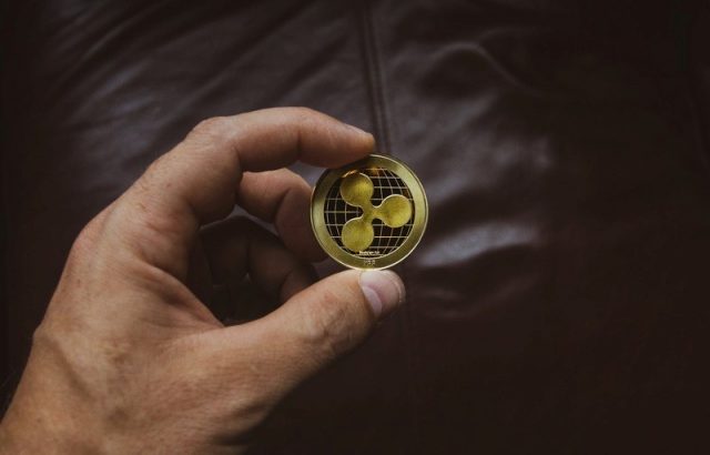 ripple coin in hand